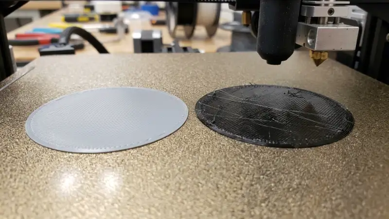 PLA vs PETG first layer comparison – PLA smooth adhesion vs PETG stringing on textured PEI build plate