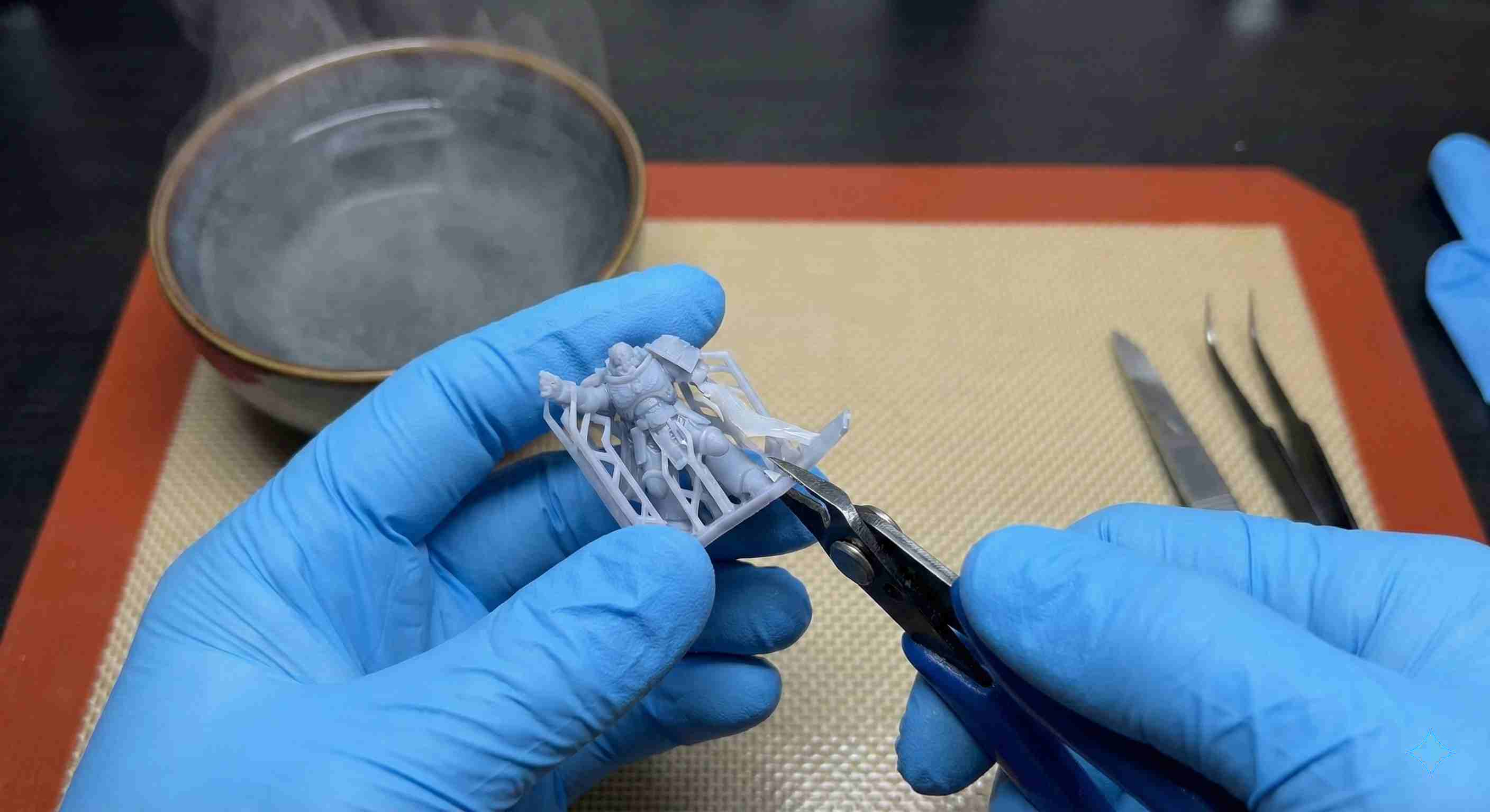 Remove resin supports with hot water – model submerged in hot water bath for easy support removal